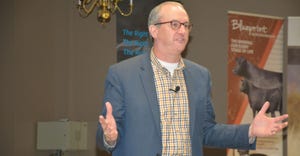 A man that appears to be addressing attendees of an event